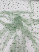 Heavy Scattered Pearls Studded Mesh, 2-Way Stretch, sold by the yard.