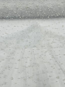 Heavy Scattered Pearls Studded Mesh, 2-Way Stretch, sold by the yard.