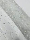 Heavy Scattered Pearls Studded Mesh, 2-Way Stretch, sold by the yard.