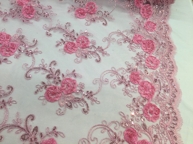 Pink 3d flowers embroider with sequins on a mesh lace fabric. Sold by the yard.