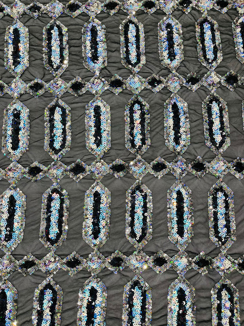 Aqua/Silver multi color iridescent Jewel sequin design on a black 4 way stretch mesh fabric.