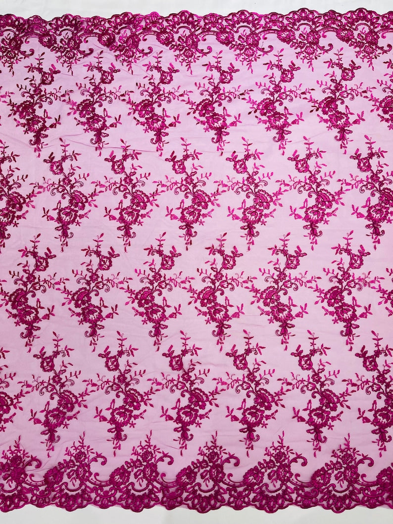 Fuchsia Corded embroider flowers on a mesh lace fabric-prom-sold by the yard.