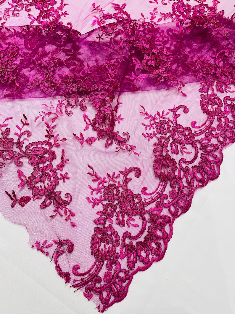 Fuchsia Corded embroider flowers on a mesh lace fabric-prom-sold by the yard.
