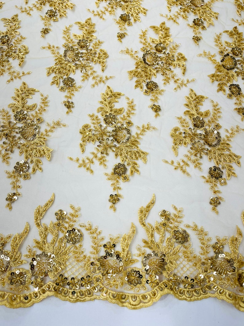 Gorgeous gold French design embroider and beaded on a mesh lace. Wedding/Bridal/Prom/Nightgown fabric-dresses-apparel-fashion-sold by yard.