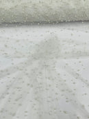 Heavy Scattered Pearls Studded Mesh, 2-Way Stretch, sold by the yard.