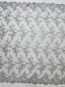 Corded embroider flowers on a mesh lace fabric-prom-sold by the yard.