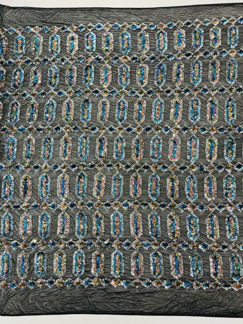 Turquoise/Silver multi color iridescent Jewel sequin design on a Black 4 way stretch mesh fabric.