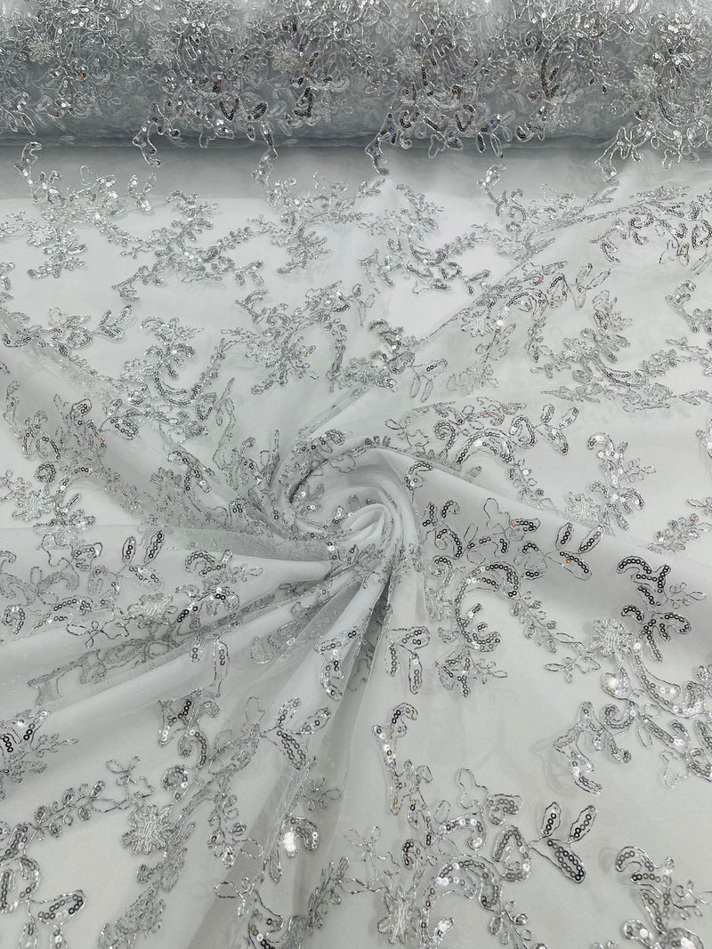 White/Silver Flower lace corded and embroider with sequins on a mesh-Sold by the yard.