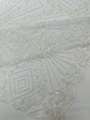 Luxury Bridal Fabric with Geometric Beading on a mesh, by The Yard.