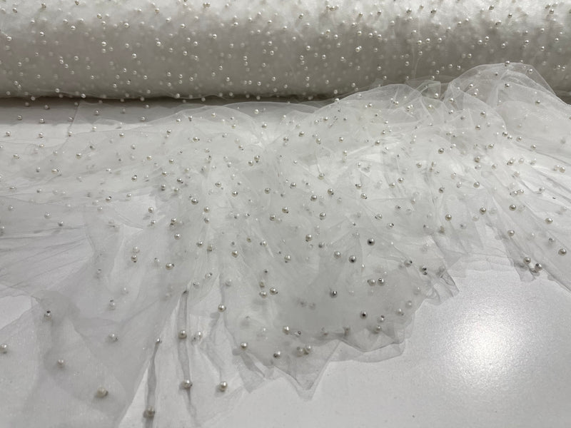 White Scattered Pearls Studded Mesh, 2-Way Stretch, sold by the yard.