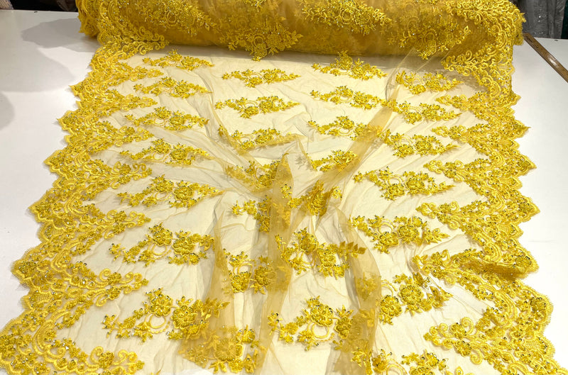 Yellow elegant hand beaded flower design embroider on a mesh lace-prom-sold by the yard.