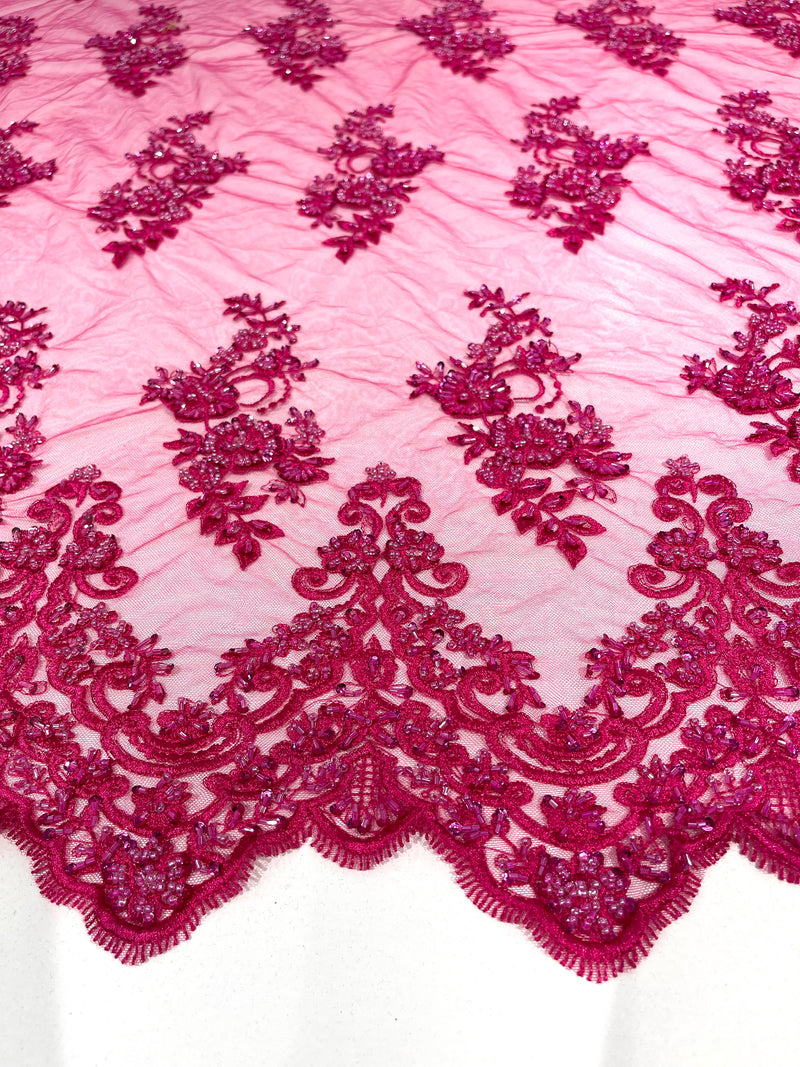 Fuchsia elegant hand beaded flower design embroider on a mesh lace-prom-sold by the yard.