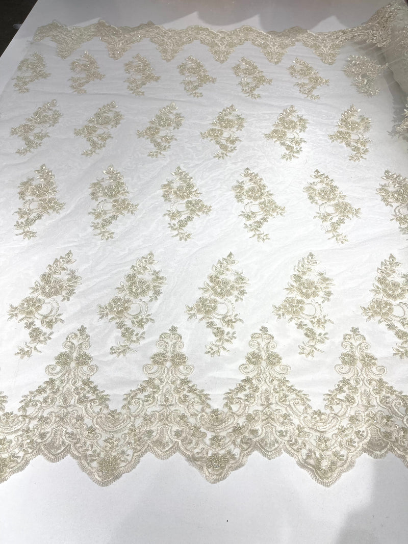 Ivory elegant hand beaded flower design embroider on a mesh lace-prom-sold by the yard.