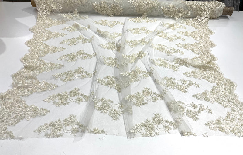 Ivory elegant hand beaded flower design embroider on a mesh lace-prom-sold by the yard.