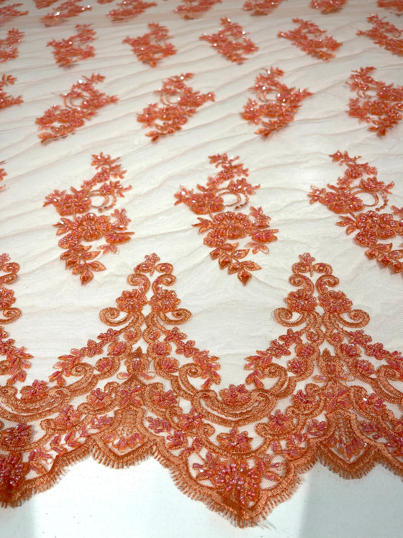 Coral elegant hand beaded flower design embroider on a mesh lace-prom-sold by the yard.