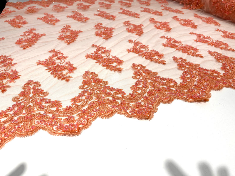 Coral elegant hand beaded flower design embroider on a mesh lace-prom-sold by the yard.