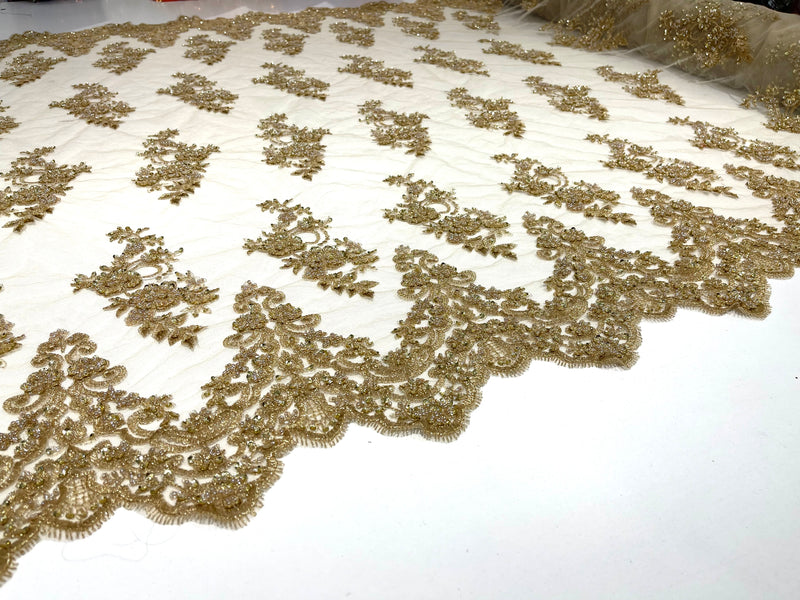 Metallic Gold elegant hand beaded flower design embroider on a mesh lace-prom-sold by the yard.