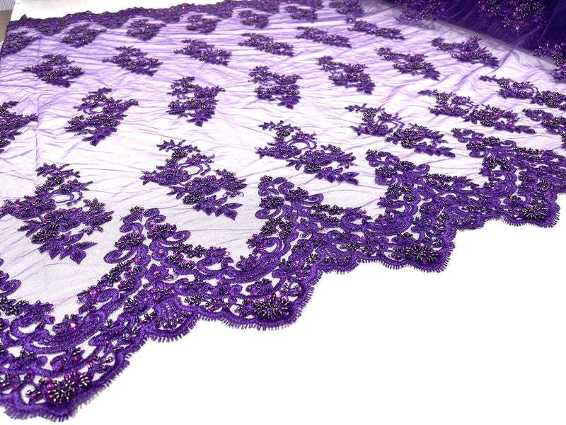Purple elegant hand beaded flower design embroider on a mesh lace-prom-sold by the yard.