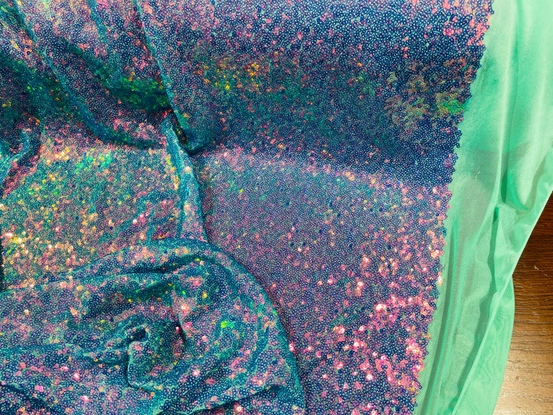 Lavender Iridescent Mini Glitz Sequins on a Mint Green 4 Way Stretch Mesh-Sold By The Yard.