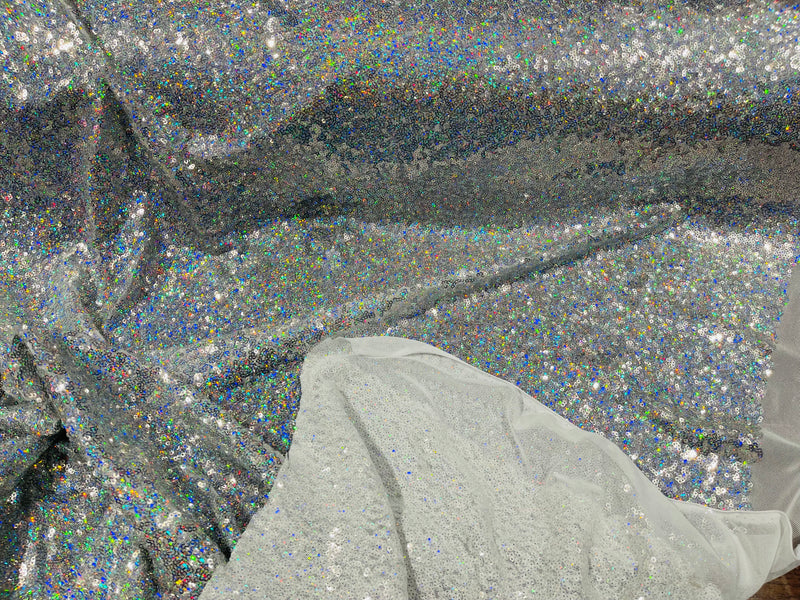 Silver Iridescent Mini Glitz Sequins on a White 4 Way Stretch Mesh-Sold By The Yard.