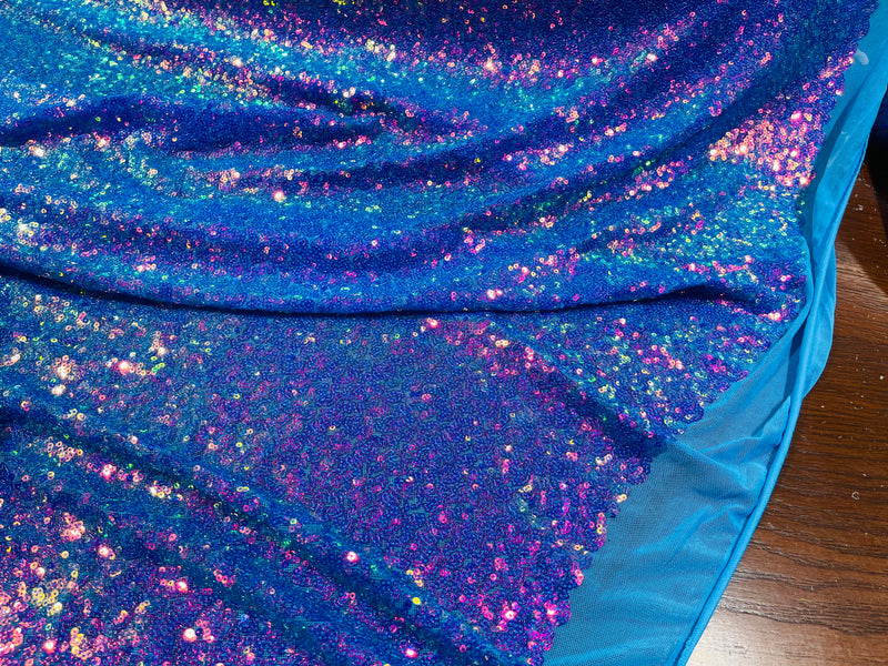 Purple Iridescent Mini Glitz Sequins on a Turquoise 4 Way Stretch Mesh-Sold By The Yard.
