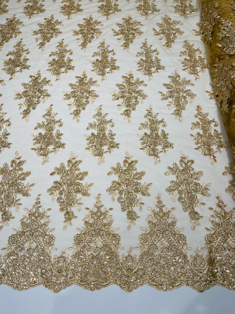 Champagne metallic floral design embroidery on a mesh lace with sequins and cord-sold by the yard.