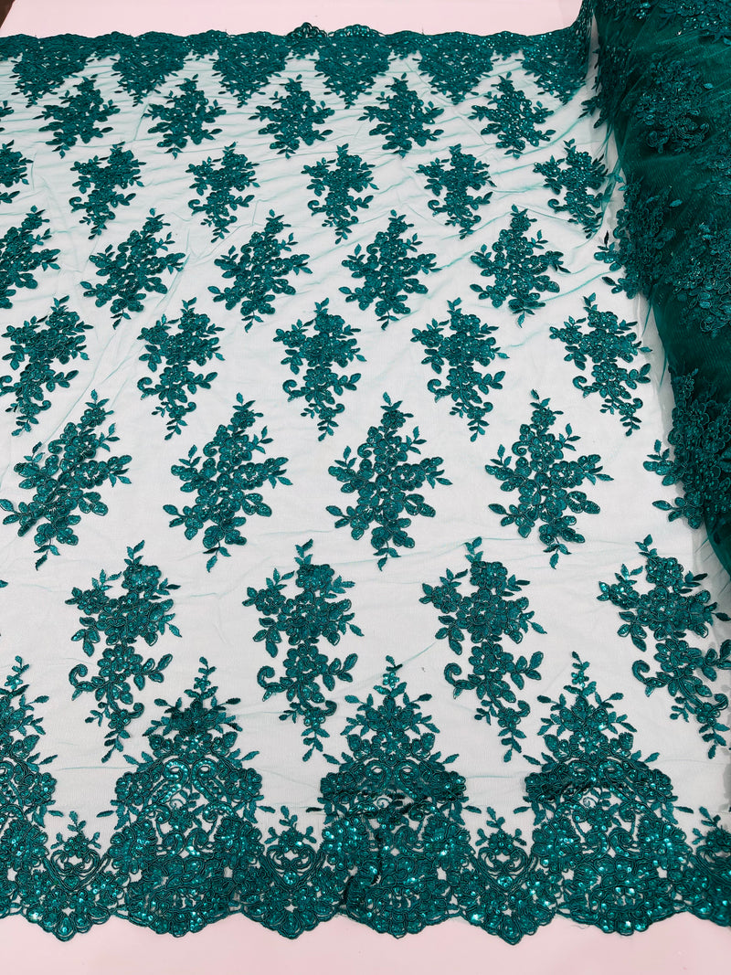 Hunter Green floral design embroidery on a mesh lace with sequins and cord-sold by the yard.