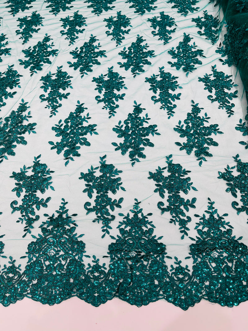 Hunter Green floral design embroidery on a mesh lace with sequins and cord-sold by the yard.