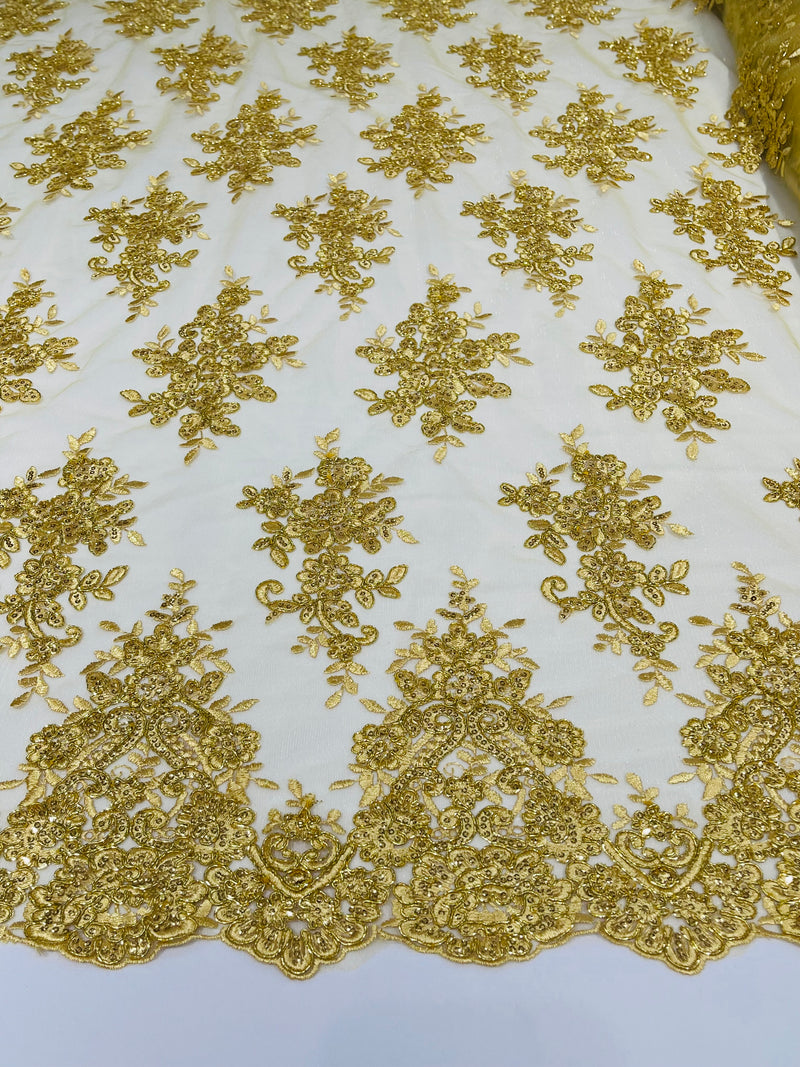 Gold Metallic floral design embroidery on a mesh lace with sequins and cord-sold by the yard.