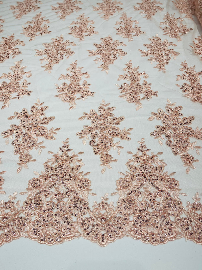 Blush Pink floral design embroidery on a mesh lace with sequins and cord-sold by the yard.