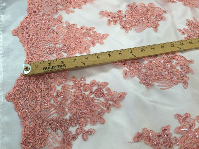 Coral flower lace corded and embroider with sequins on a mesh. Wedding/bridal/prom/nightgown fabric. Sold by the yard.