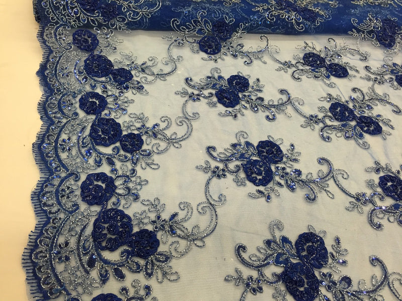 Royal blue 3d flowers embroider with sequins on a mesh lace fabric. Sold by the yard.