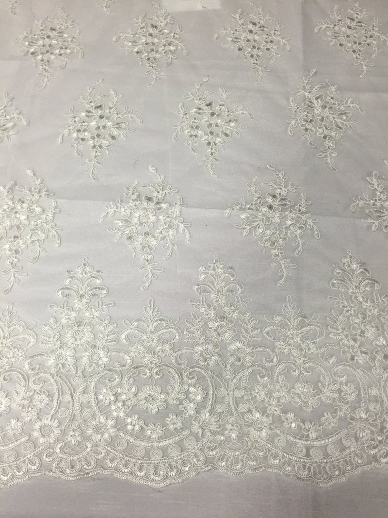 Ivory royal flowers embroider with sequins and corded on a mesh lace -yard