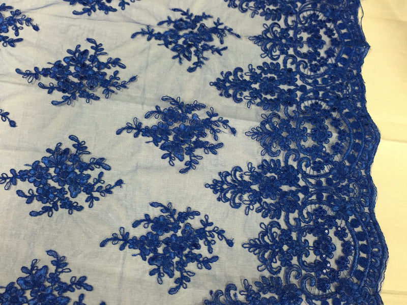 Royal blue royal flowers embroider with sequins and corded on a mesh lace-yard