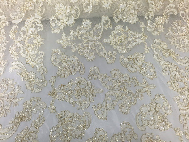 Ivory/metallic gold french design embroider and hand beaded with pearls ans sequins on a mesh lace-dresses-fashion-apparel-Sold by the yard.