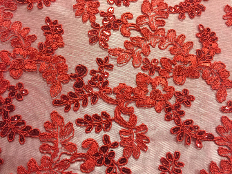 Red corded flowers embroider with sequins on a mesh lace fabric-sold by the yard-