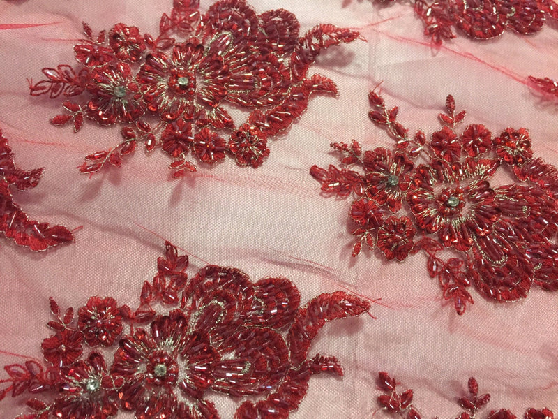 Red flowers embroider and heavy beaded on a mesh lace fabric-sold by the yard-