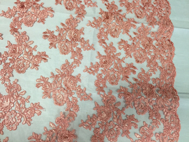 Coral modern roses embroider and corded on a mesh lace -yard