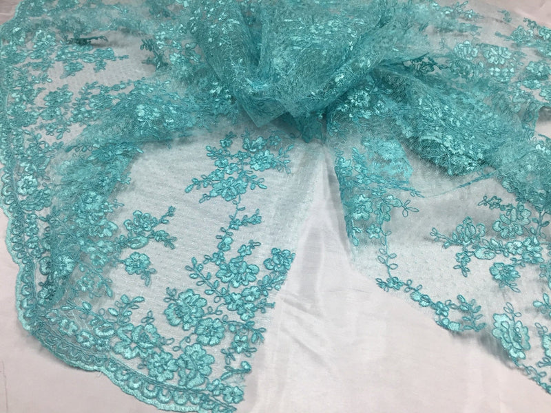 Sensational aqua flowers Embroider And Corded On a mesh lace-prom-nightgown-dresses-decorations-sold by the yard.