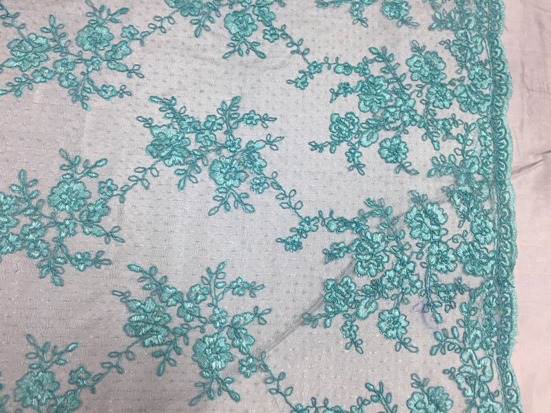 Sensational aqua flowers Embroider And Corded On a mesh lace-prom-nightgown-dresses-decorations-sold by the yard.