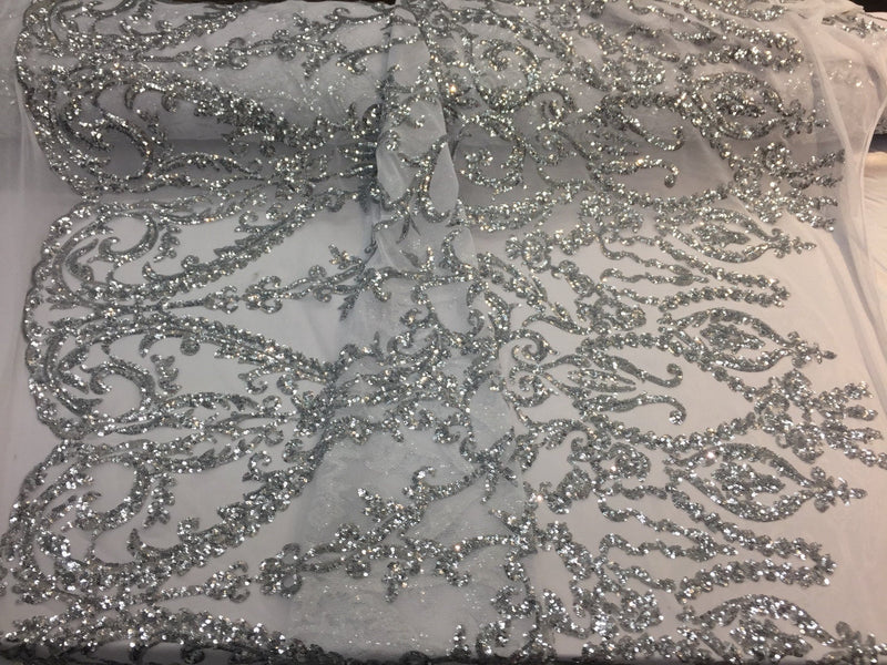 Silver damask design embroider with Sequins on a 2 way stretch white mesh-fashion-dresses-yards gowns-decorations-sold by the yard.