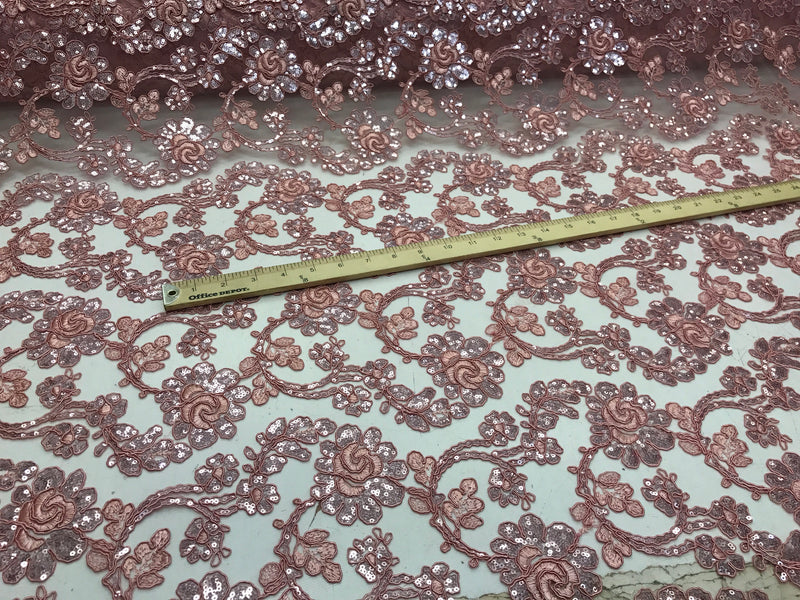 Dusty rose flowers embroider with sequins and corded on a mesh lace-wedding-bridal-prom-nightgown-decorations-sold by the yard.