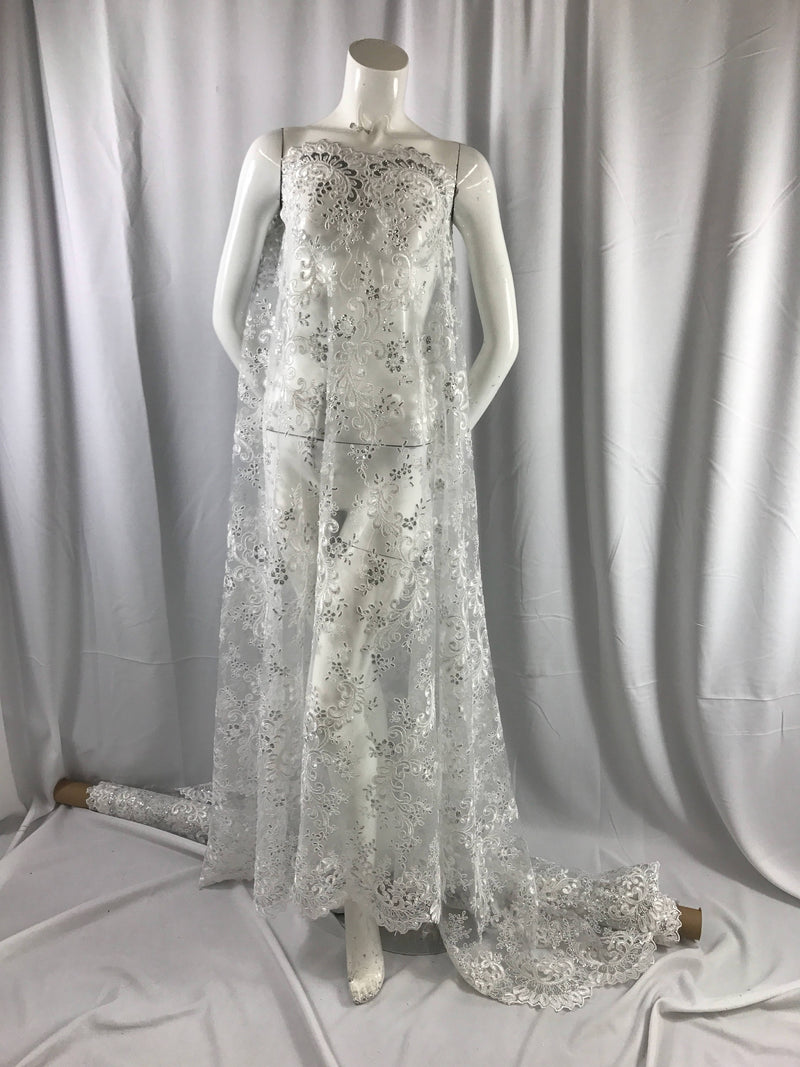 White corded french design-embroider with sequins on a mesh lace fabric-wedding-bridal-nightgown-prom-dresses-fashion-sold by the yard.