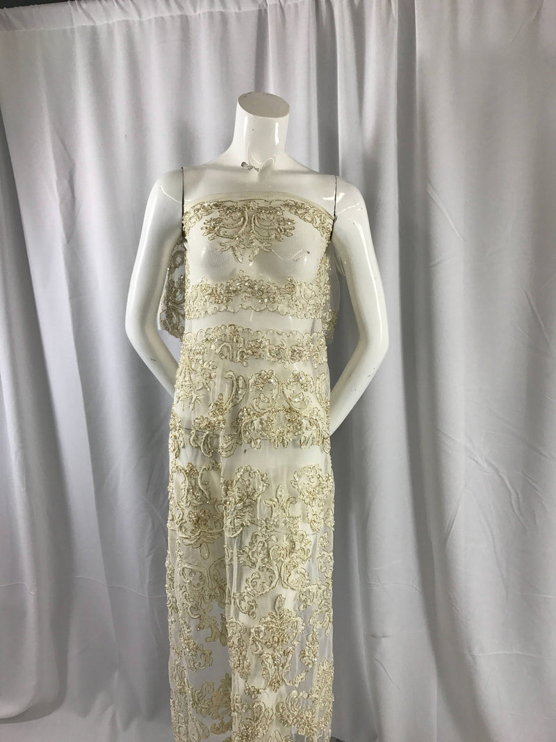 Ivory/metallic gold french design embroider and hand beaded with pearls ans sequins on a mesh lace-dresses-fashion-apparel-Sold by the yard.