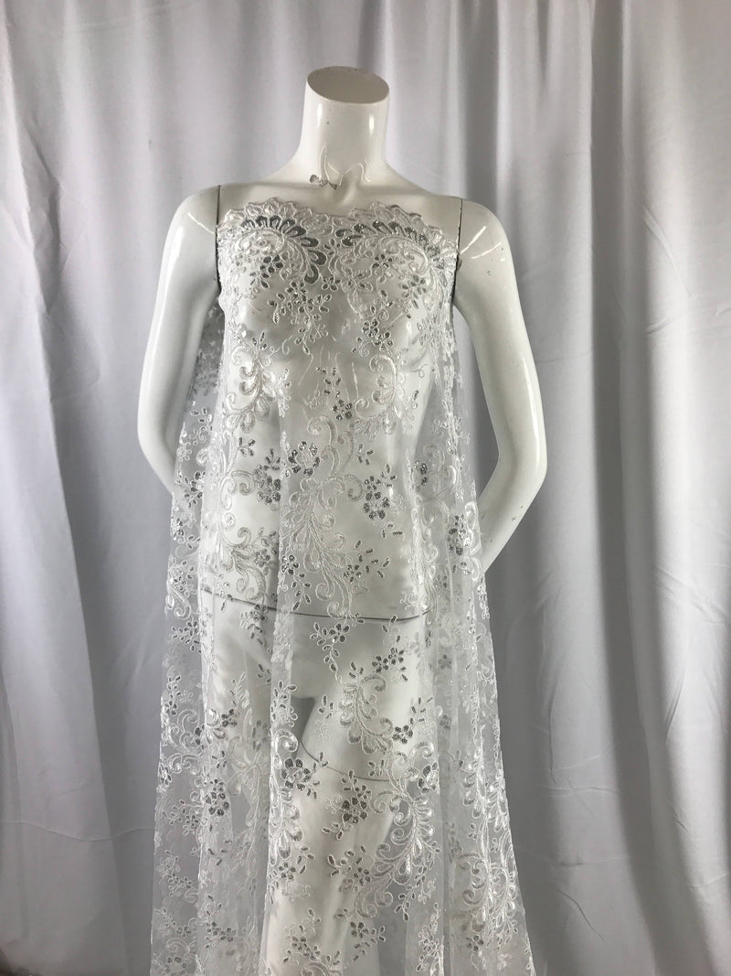 White corded french design-embroider with sequins on a mesh lace fabric-wedding-bridal-nightgown-prom-dresses-fashion-sold by the yard.