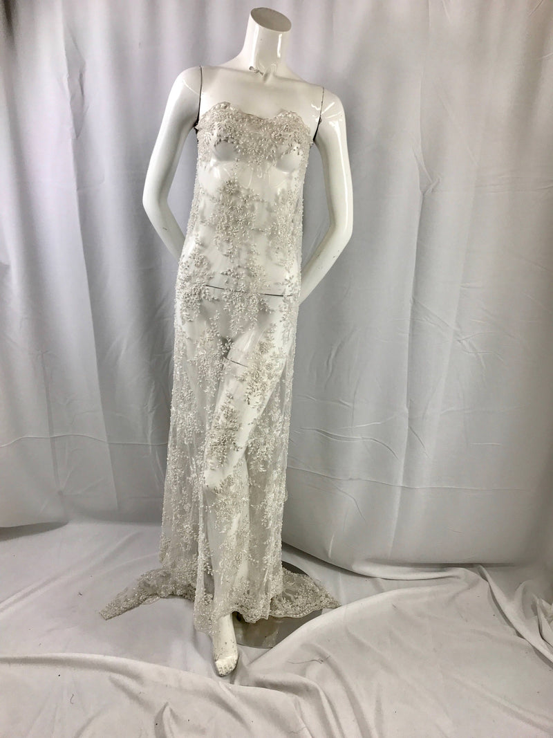 Gorgeous off white French design embroider and beaded on a mesh lace. Wedding/Bridal/Prom/Nightgown/dresses/fashion/sold by the yard.