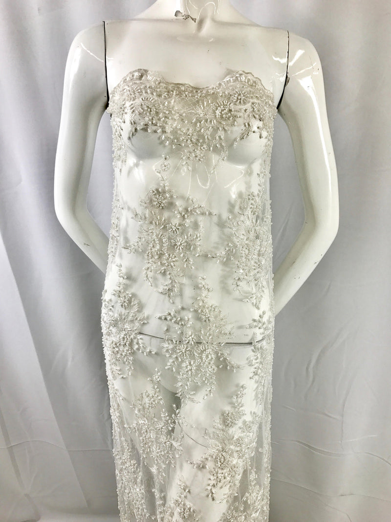 Gorgeous off white French design embroider and beaded on a mesh lace. Wedding/Bridal/Prom/Nightgown/dresses/fashion/sold by the yard.