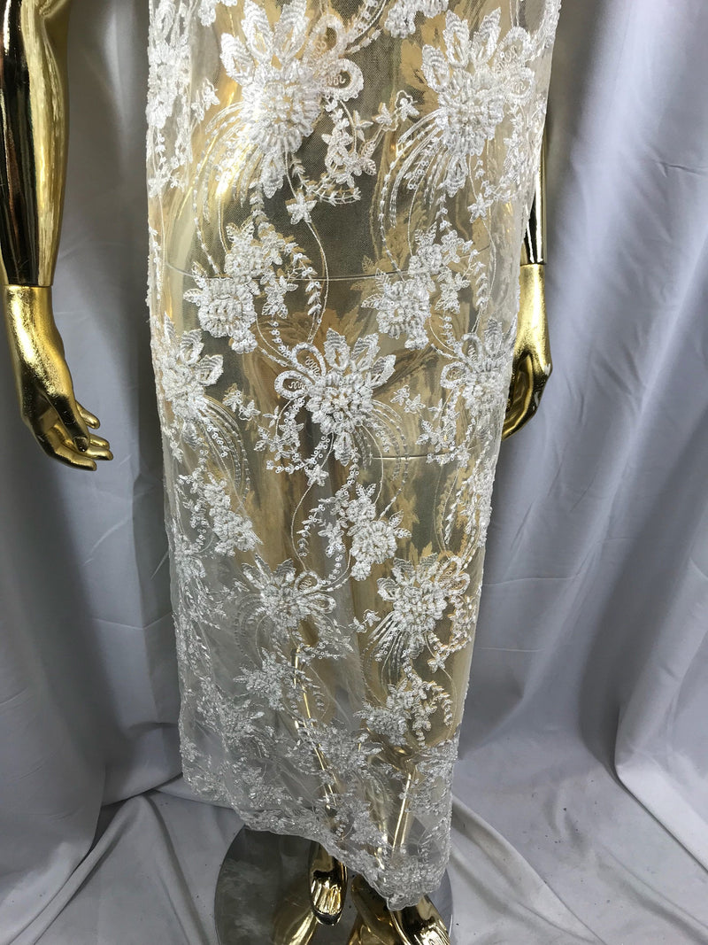 Ivory hand beaded floral design embroider on a mesh lace-dresses-fashion-apparel-wedding-prom-nightgown-decorations-sold by the yard.