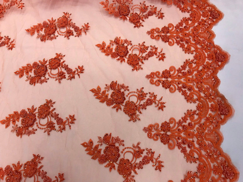 Orange hand beaded floral design embroidery with shiny sequins on a mesh lace-dresses-apparel-fashion-prom-nightgown-sold by the yard.