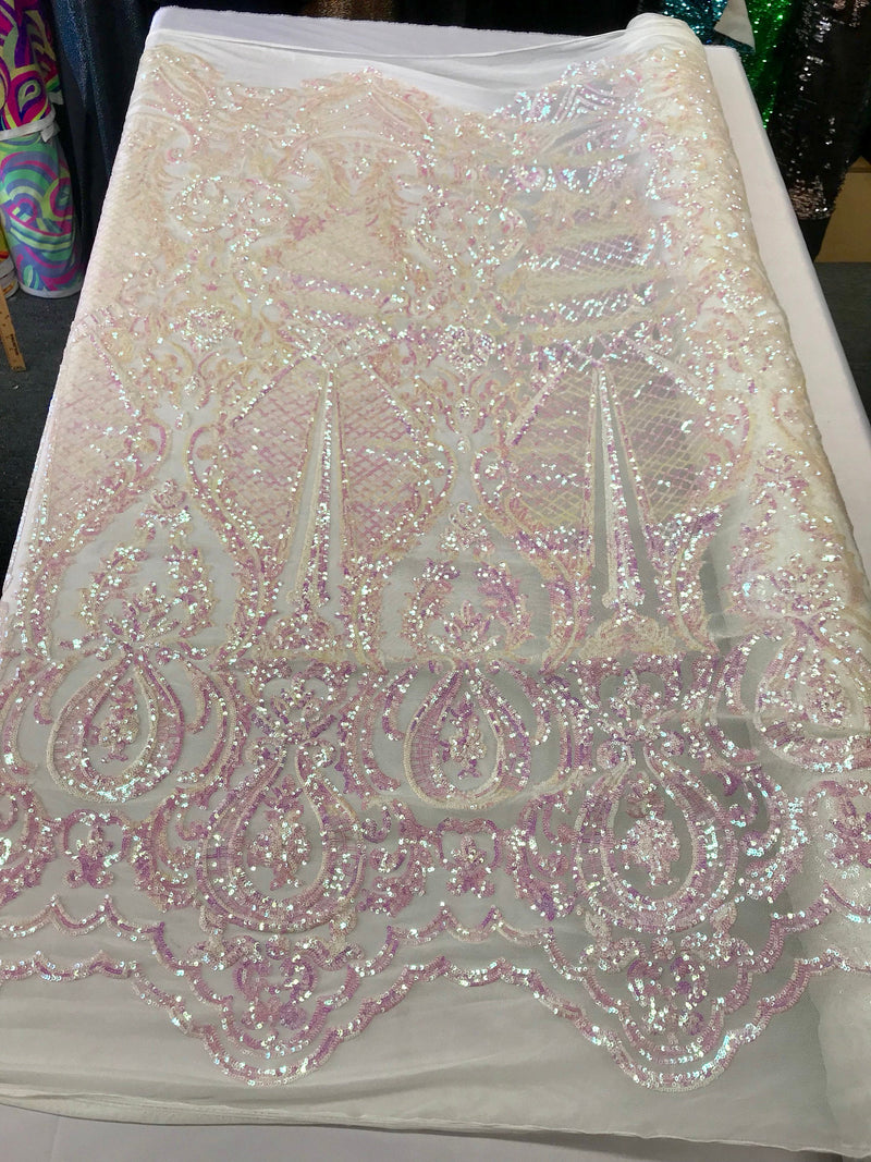 Pink princess design iridescent sequins on a 4 way stretch white mesh-sold by the yard.